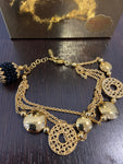 BRACCIALE LORENZO UNGARI DORATO C/PIETRE NERE