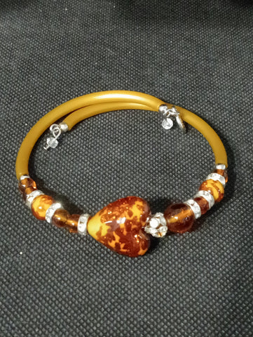 BRACCIALE RIGIDO C/PIETRE TIPO MURANO AMBRATE