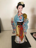 GEISHA IN PORCELLANA E TESSUTO H30XL13 CM