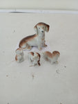 FAMIGLIA CANI IN PORCELLANA H5XL5 CM  4 PZ